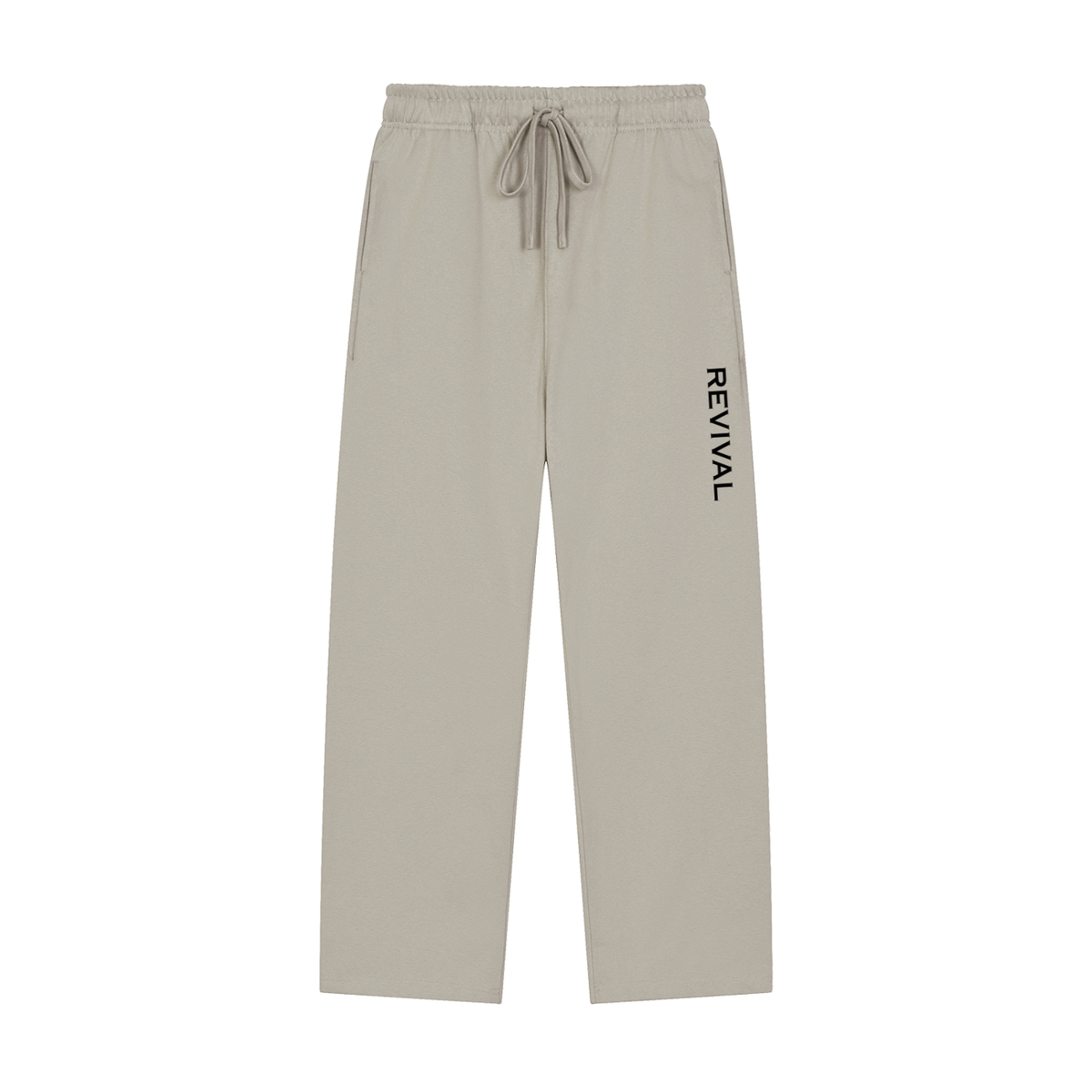 A pair of light beige drawstring sweatpants with the brand name 'REVIVAL' printed vertically in black on the left leg, shown against a plain white background.