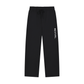 Black wide-leg sweatpants with a white vertical 'REVIVAL' text print on the left leg, featuring an elastic drawstring waistband, shown against a plain white background.