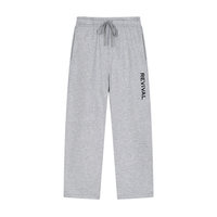 Light gray heather sweatpants with a drawstring waist and vertical black 'REVIVAL' text on the left leg, shown flat against a white background.