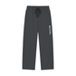 Dark gray jogger pants with an elastic drawstring waist and a vertical white 'REVIVAL' logo printed on the left leg, shown against a plain white background.