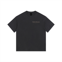 A dark charcoal gray short-sleeve t-shirt with 'REVIVAL' printed in a metallic gold serif font on the left chest, displayed flat against a solid white background.