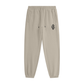 Apricot jogger pants with a brand logo on a white background
