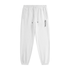 White tapered jogger pants with an elastic drawstring waistband, side pockets, elastic cuffs, and vertical black REVIVAL lettering on the upper thigh.


