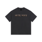 A dark charcoal gray crewneck t-shirt with the text 'MFTR WSFU' printed across the chest in a metallic gold and silver gothic font, displayed on a clean white background.