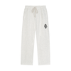 Light heather gray sweatpants with an elastic drawstring waist and a small green circular patch on the left thigh, shown against a plain white background.