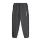 Black jogger pants with a logo on a white background