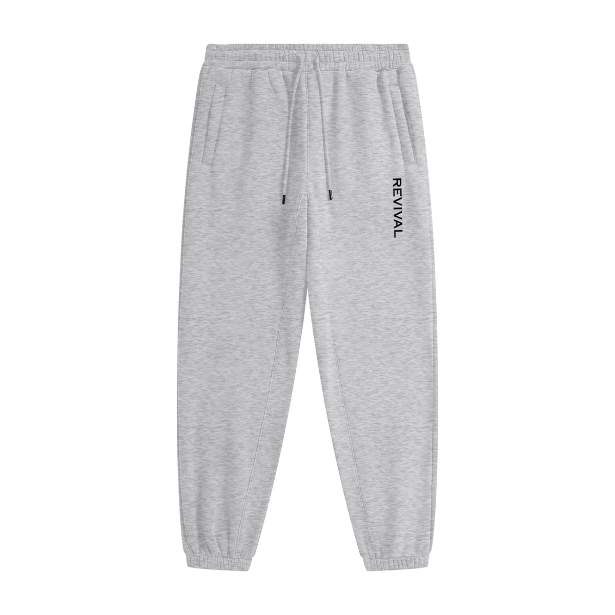 Gray tapered jogger pants with an elastic drawstring waistband, side pockets, elastic cuffs, and vertical black REVIVAL lettering on the upper thigh. 
